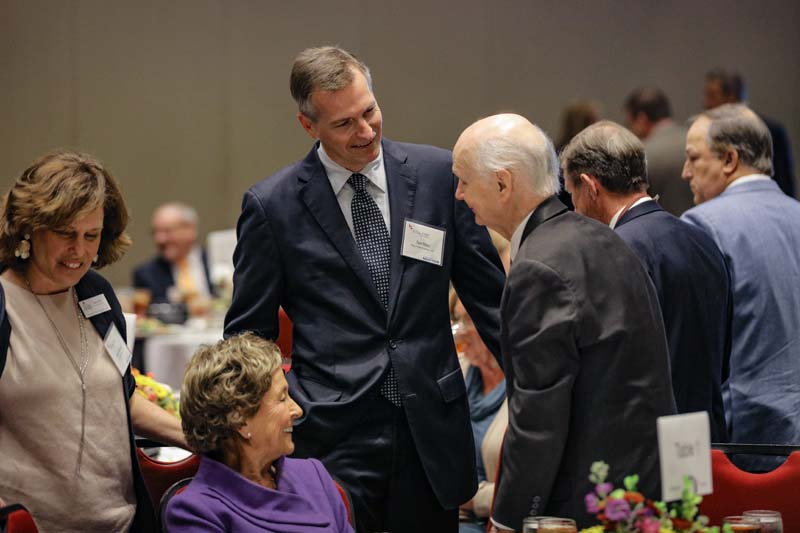 Ted Riley speaking with his father, Secretary Riley, and Betty Farr