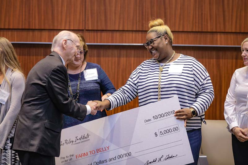 (l-r) Secretary Riley and Avery Allen, who was accepting the 2018 WhatWorksSC cash award for Grow to Greatness, formerly Farm to Belly