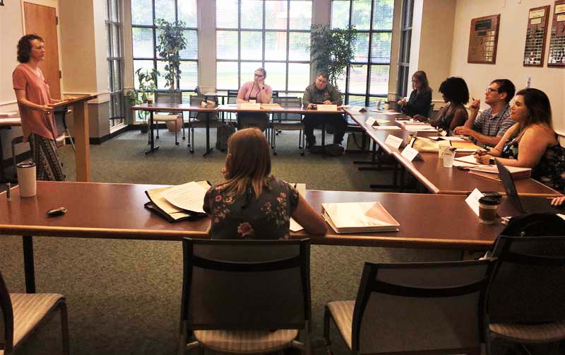 Danielle Vinson, professor of the Deparment of Politics and International Affairs, speaking to the group about 