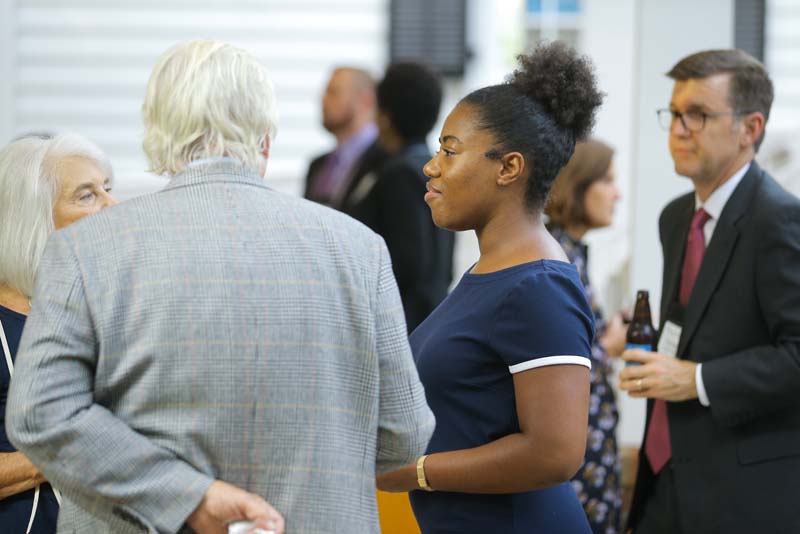 Shekinah Lightner, Advance Team member and Riley Institute intern, speaking with Terry Peterson and Scott Shanklin-Peterson