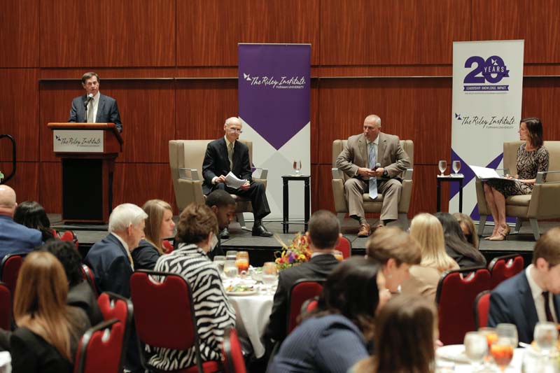 Don Gordon introducing panelists, Secretary Riley and Danny Merck, and moderator Jacki Martin