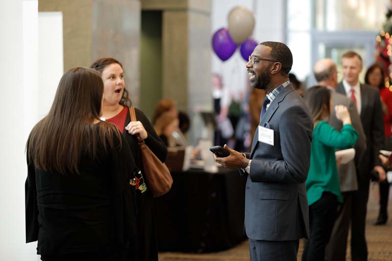Damon Qualls, Principal of Monaview Elementary School, speaking with Meagan Hawkins and Amy Lynch, both teachers from Monaview Elementary School