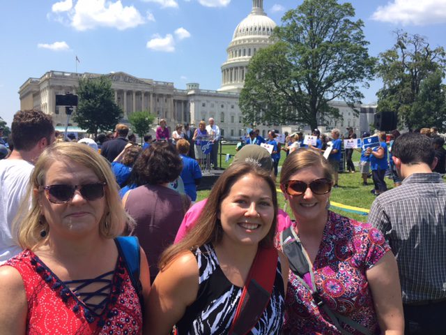 A protest being held in front of the Capitol Building: (l-r) Melissa Brown, Stephanie Peagler and Jennifer Wike