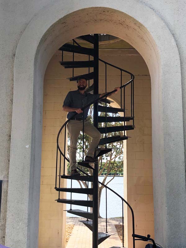 Brent Balog on the steps of Furman's Bell Tower