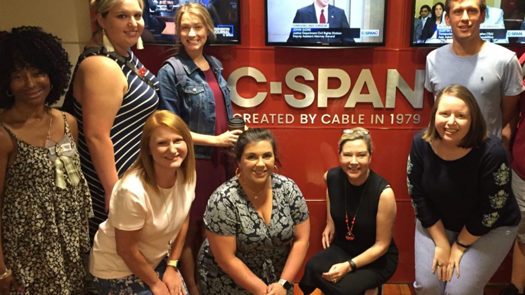 Teachers of Government participants stand inside C-SPAN studios