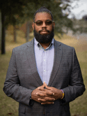 Head shot of a man in a suit. 