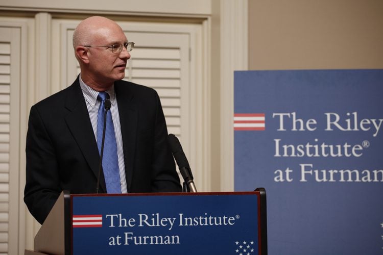Furman professor Cleve Fraser introducing Thomas Boyatt