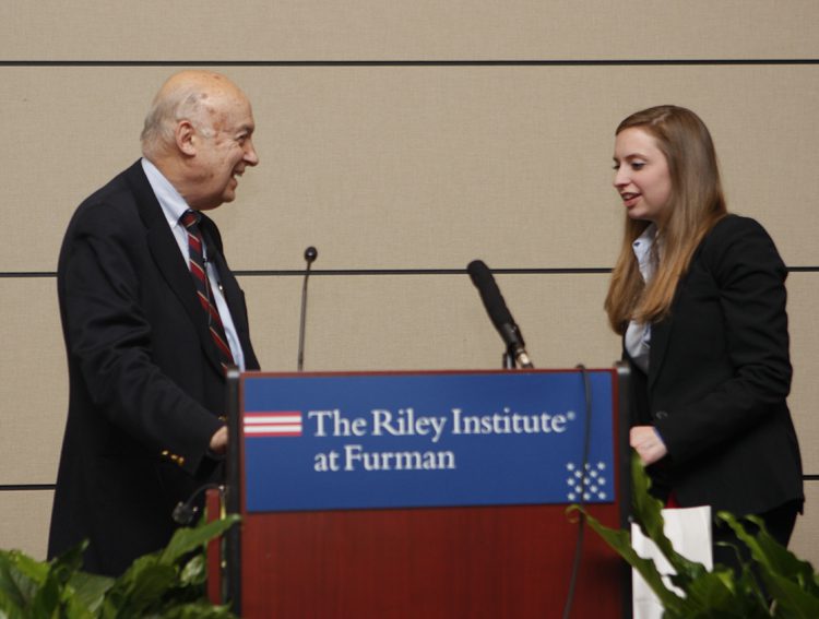 Marshall Goldman receiving his gift from an Advance Team member