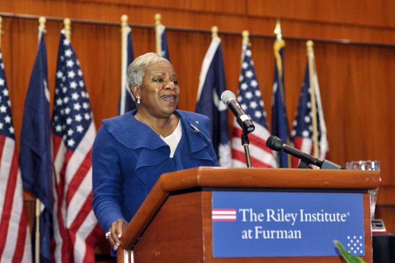Juana Slade singing the National Anthem