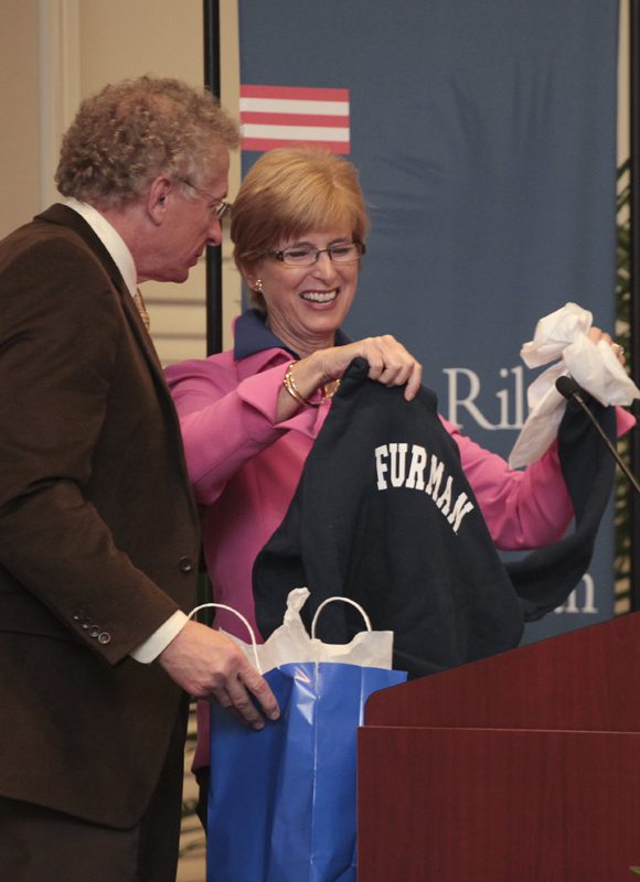 Governor Whitman was presented a Furman sweatshirt