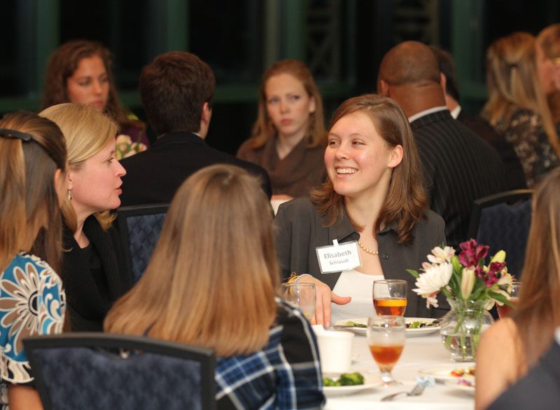 Elisabeth Schault conversing with Kristy Maher, Professor of Sociology