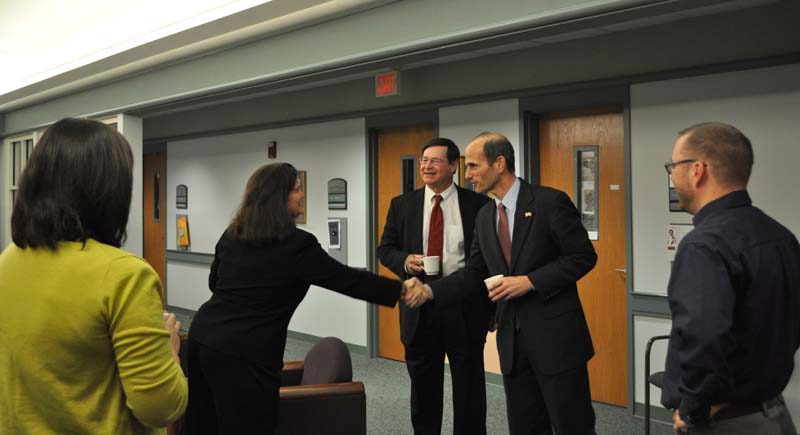 Kate Kaup, Professor of Political Science, meeting John Baldacci