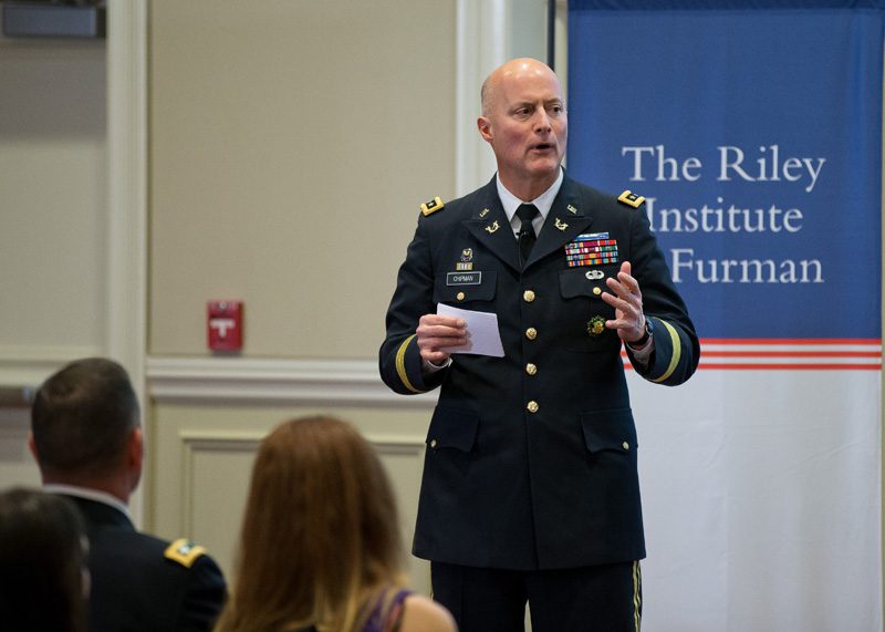 Lieutenant General Dana Chipman speaking on legal issues that face the military