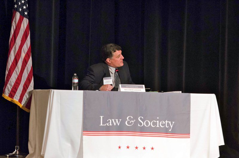 William Janssen, Associate Professor of Law at the Charleston School of Law, moderating the panel on Religious Symbols from Creches and Menorahs to Crosses and Mottos