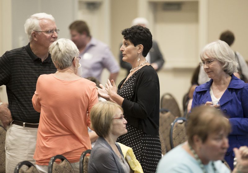 Carmela Epright speaking with guests