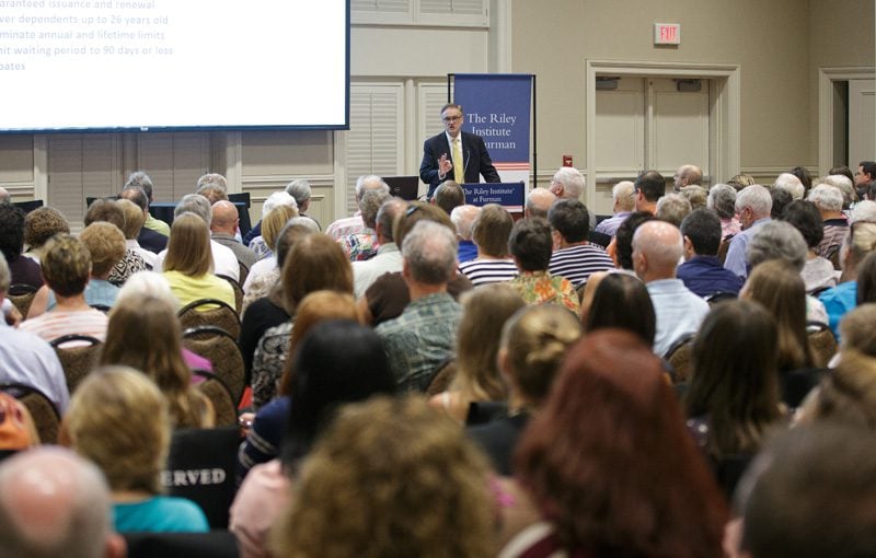 Hugh Greene speaking to a full house