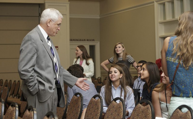 Carl Kohrt visiting with some Furman students