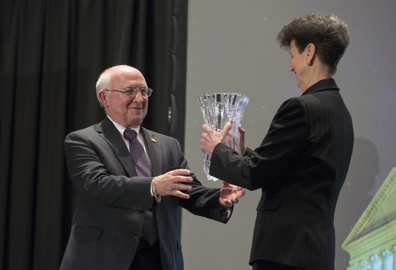 Paul Campbell receiving the award from Paula