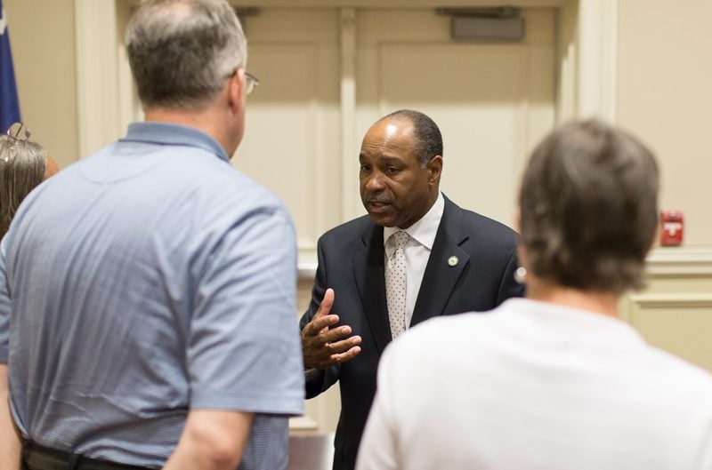 Jerry Adger speaking with guests