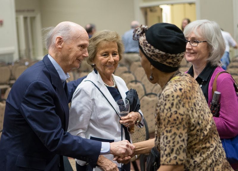 Dick Riley and Betty Farr speaking with guests