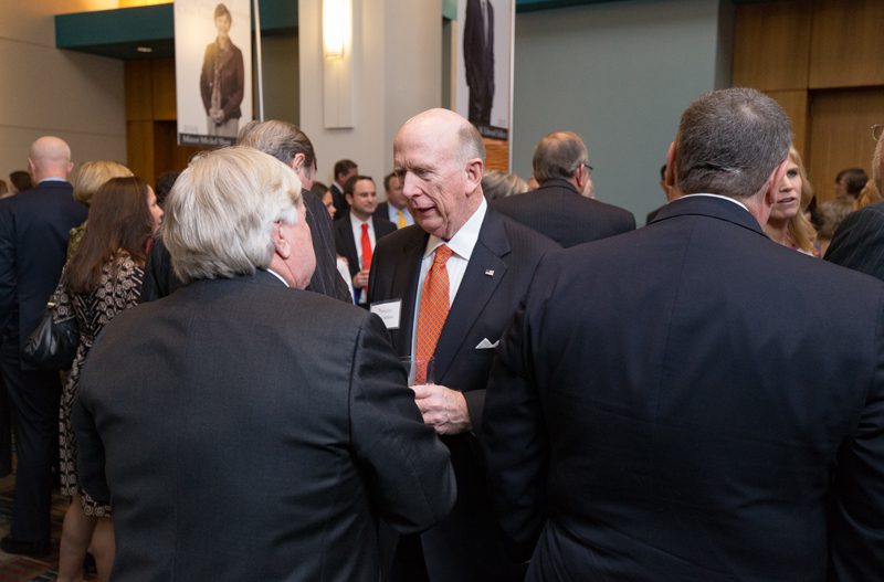 David Wilkins speaking with a guest