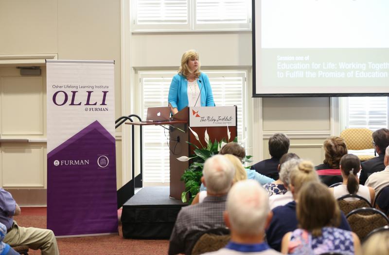 Elizabeth Davis, President of Furman University, welcoming all to the event