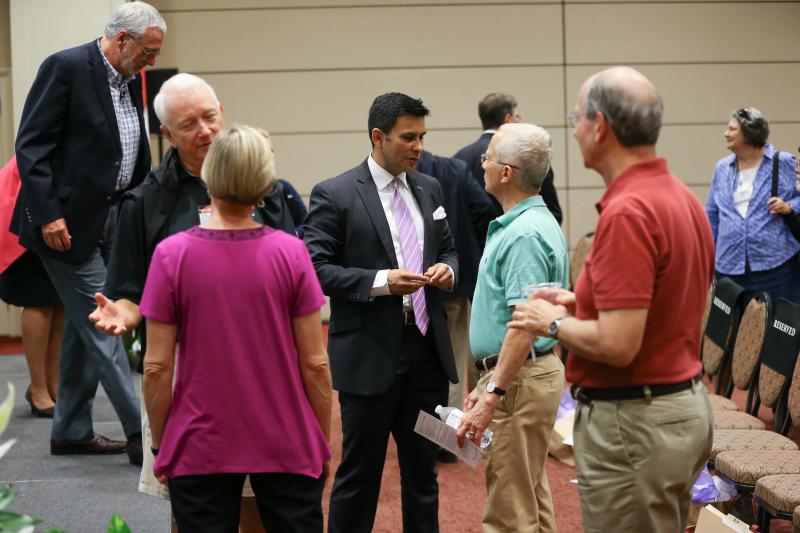 Guest speakers continuing the conversation with guests