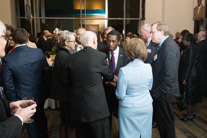 Secretary Riley and Betty Farr mingling with guests
