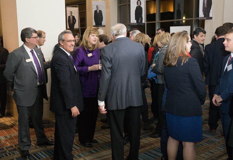 Elizabeth Davis and Charles Davis mingling with guests
