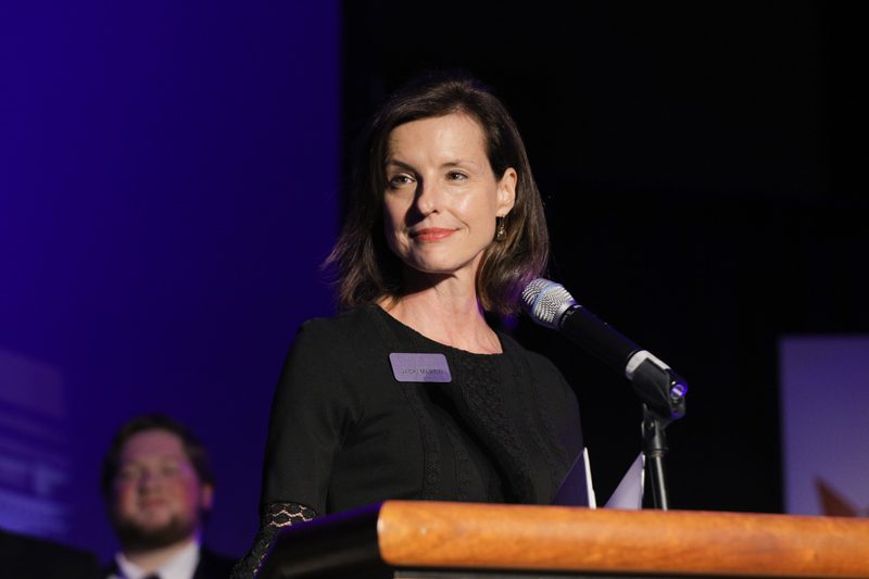 Jacki Martin, Deputy Director at the Riley Institute, introducing the Bell Tower Boys