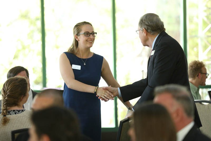 Emilee O'Brien meeting Mike McConnell '66, former U.S. director of National Intelligence