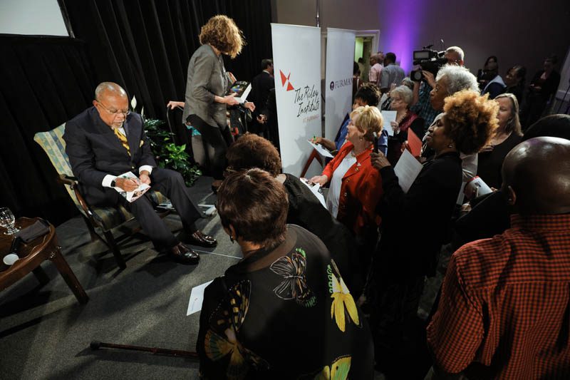 Henry Louis Gates signing books and programs