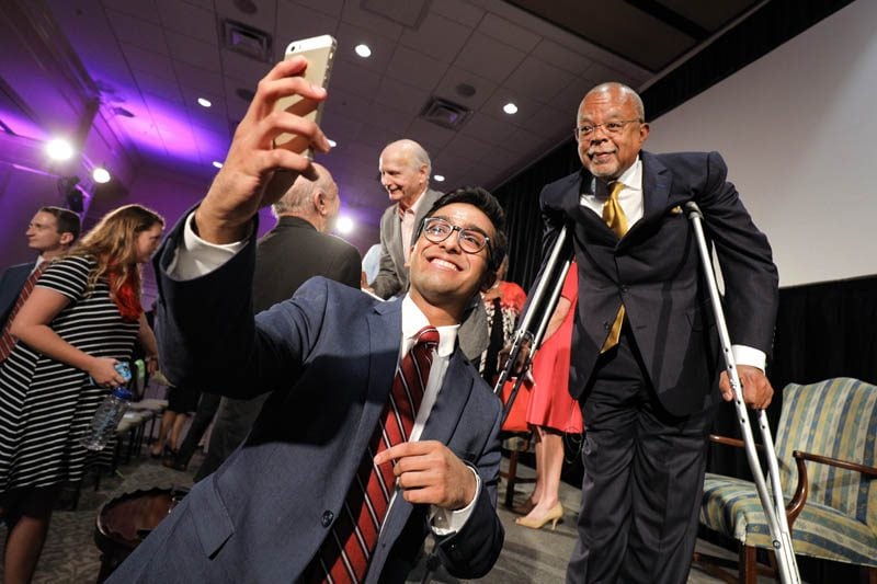 Advance Team member Sulaiman Ahmad taking a selfie with Henry Louis Gates