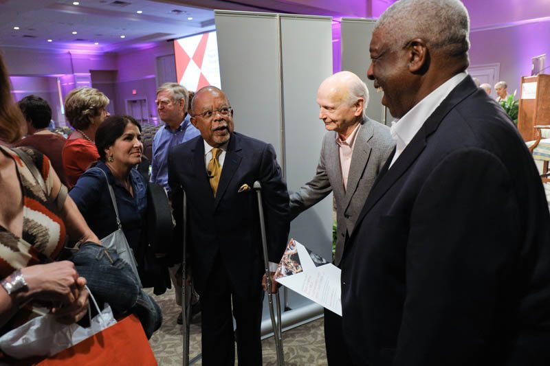 Henry Louis Gates speaking with a guest