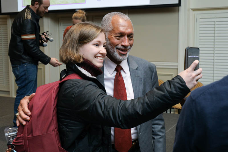 Student taking a selfie with Charles Bolden