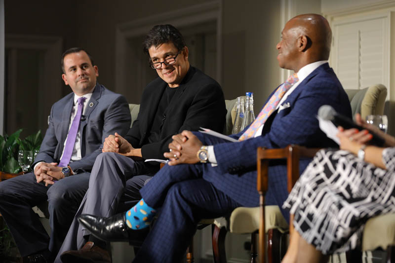 (l-r) Neal Collins, Akan Malici speaking and Garry McFadden