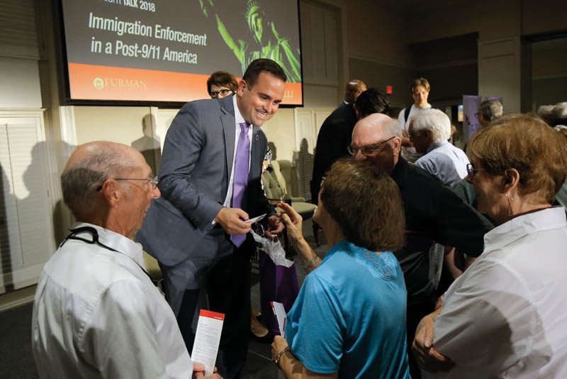 Neal Collins visiting with guests