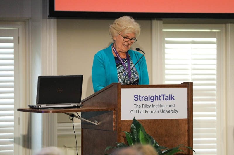 May Welborn, OLLI Council President, introducing the speakers
