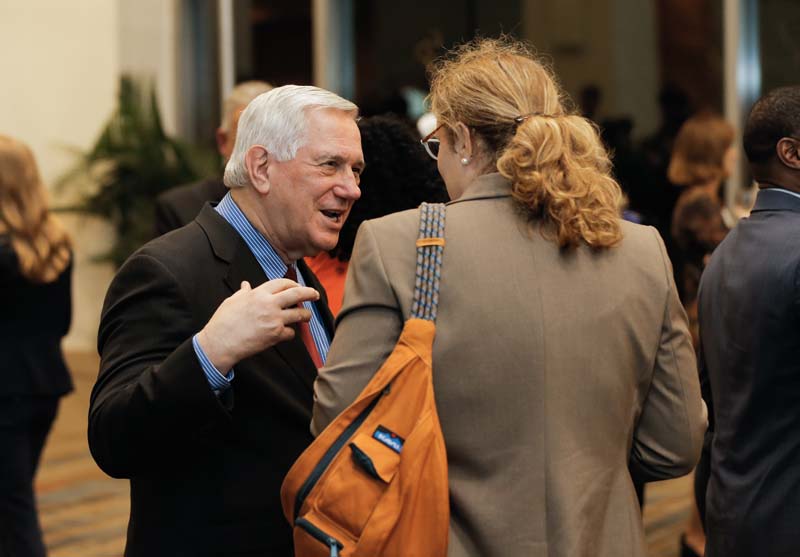 Bill Barnet, awarded the 2014 Wilkins Award for Excellence in Civic Leadership, speaking with a guest