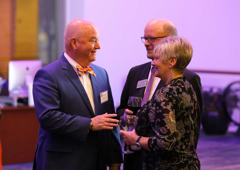 Chuck Saylors speaking with Nancy and Benny Walker