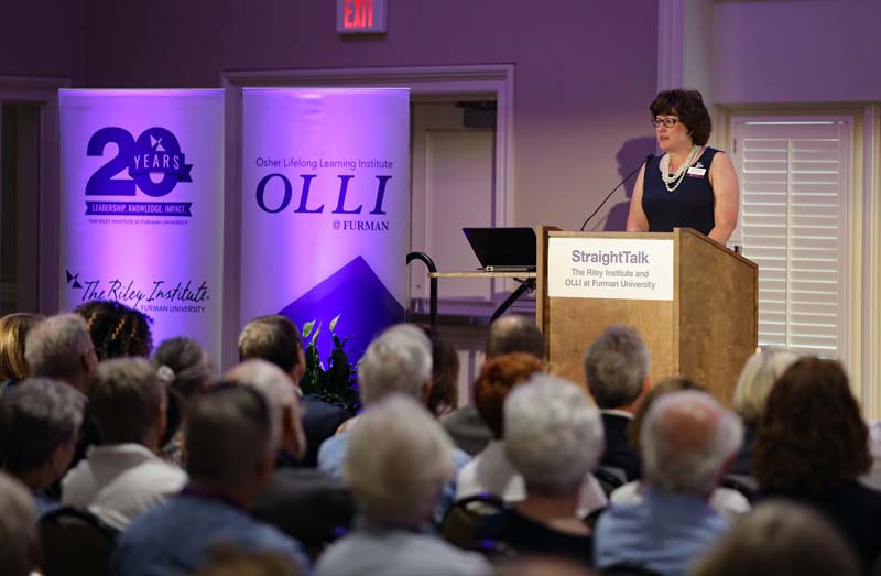 Nancy Kennedy, Director of the Osher Lifelong Learning Institute (OLLI) at Furman University, welcoming guests to the program