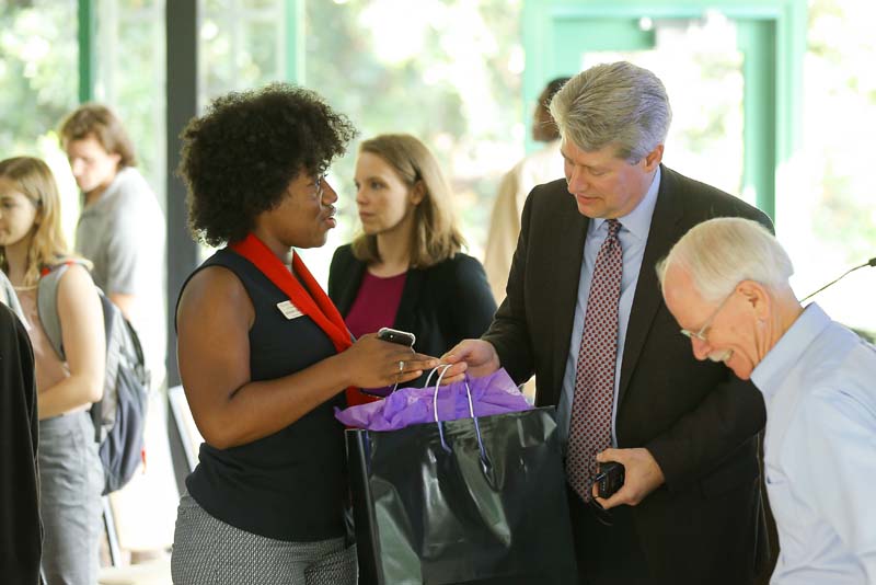 Advance Team member Shekinah Lightner ('20) presenting Andy Rudalevige with a gift of appreciation