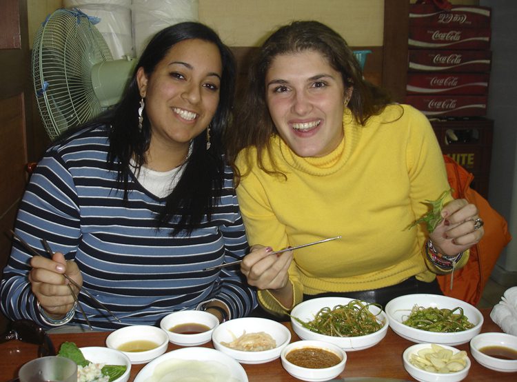 Cindy Youssef and Nadia Savova eating a Korean meal