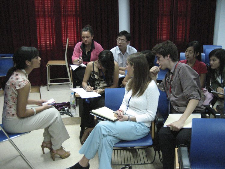 The students meet in small groups preparing for interviews with the various business leaders