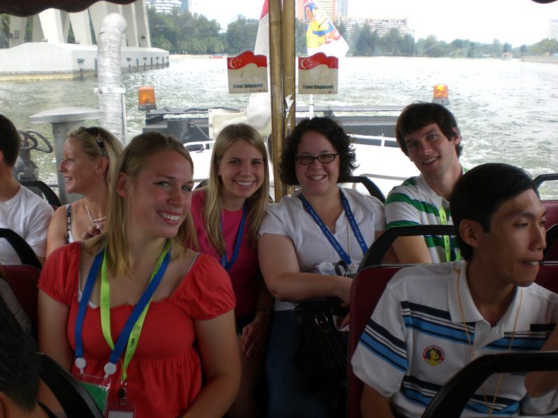 The students taking a boat tour of Singapore