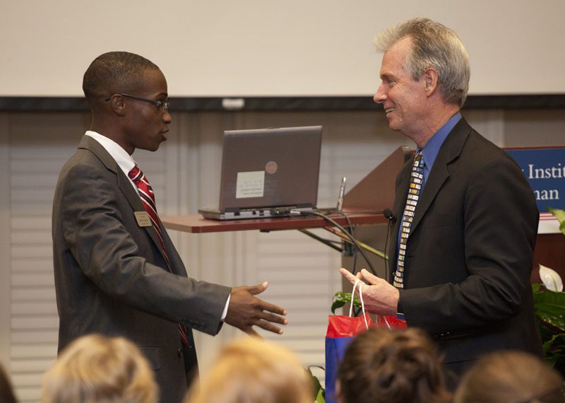 Keith Early presenting a gift of appreciation to Quigley