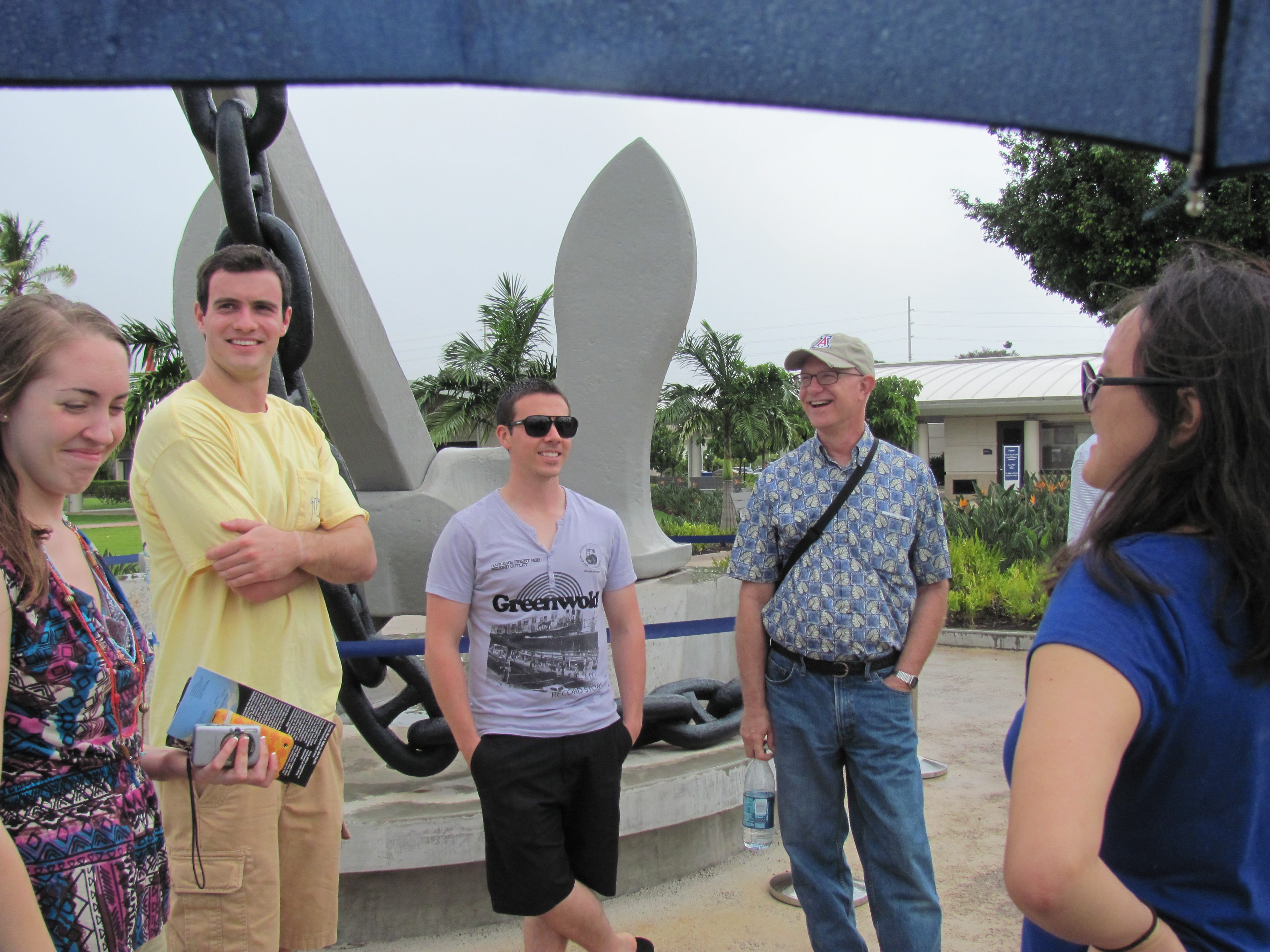 The group standing in front of the USS Arizona anchor