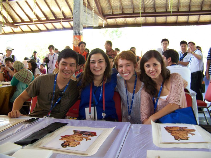 Emily with Mark (Philippines), Stacey (Australia), and Paola (Mexico) during a special art lesson in Kamasan Village