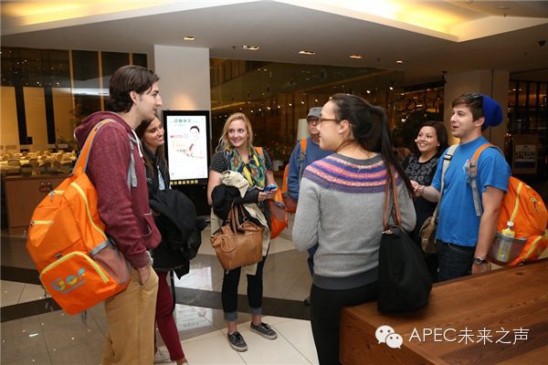 Students from around the APEC region chatting in the lobby