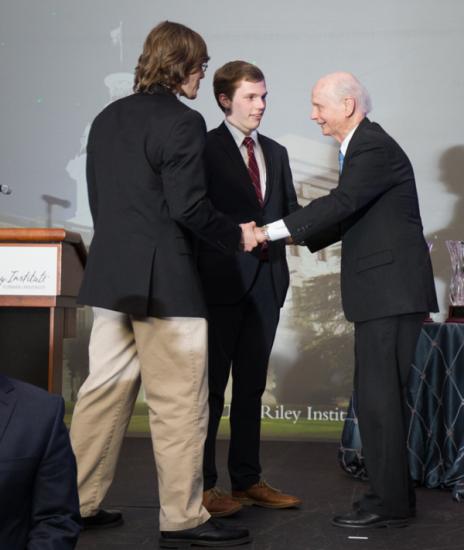 Logan Underwood and Noah Zimmerman with Secretary Riley at the Wilkins Awards Dinner